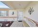 Inviting covered front porch features decorative wall art and a charming bench at 9857 Sw 63Rd Ct, Ocala, FL 34476