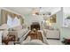 Spacious living room featuring comfortable seating, large windows, and easy access to the dining area at 9857 Sw 63Rd Ct, Ocala, FL 34476
