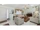 The open living room features comfortable seating and a large window, perfect for relaxation and entertainment at 9857 Sw 63Rd Ct, Ocala, FL 34476