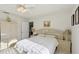 Serene bedroom with a ceiling fan, bedside tables, and a cozy atmosphere for relaxation at 9857 Sw 63Rd Ct, Ocala, FL 34476