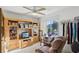 Well-organized office space with custom cabinetry, a desk, and a comfortable chair at 9857 Sw 63Rd Ct, Ocala, FL 34476