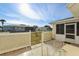 Outdoor patio with dining set overlooking the green backyard and neighboring homes at 9857 Sw 63Rd Ct, Ocala, FL 34476