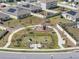 Aerial view of the community park offering playground, dog park, and green space at 197 Pineywoods St, St Cloud, FL 34772