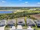 A picturesque aerial view of a neighborhood and golf course landscape at 197 Pineywoods St, St Cloud, FL 34772