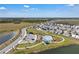 Aerial view of a community pool surrounded by lounge chairs and picnic area at 197 Pineywoods St, St Cloud, FL 34772