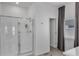 Clean bathroom featuring a glass-enclosed shower, modern fixtures, and neutral tones at 197 Pineywoods St, St Cloud, FL 34772