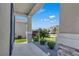 A covered porch with stone accents and well-maintained landscaping at 197 Pineywoods St, St Cloud, FL 34772