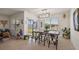 Bright dining room with a modern light fixture, sliding doors to the backyard at 2897 Sunridge Loop, St Cloud, FL 34771