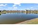 Scenic pond view highlighting the water fountain and surrounding neighborhood at 2897 Sunridge Loop, St Cloud, FL 34771