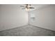 Bedroom with neutral carpet, ceiling fan, and a bright window at 29447 Caspian St, Leesburg, FL 34748