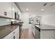 Modern kitchen with white cabinets, stainless steel appliances, and island sink at 29447 Caspian St, Leesburg, FL 34748