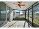 Enclosed patio with ceiling fan and view of the backyard at 29447 Caspian St, Leesburg, FL 34748