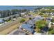 An aerial view of homes in the community with views of a lake in the distance at 2982 Lake Huron Ln, Tavares, FL 32778