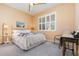 Cozy bedroom with comfortable bed, plantation shutters, and neutral decor creating a warm and inviting space at 2982 Lake Huron Ln, Tavares, FL 32778