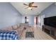 Inviting living room featuring wood floors and comfortable seating at 34448 Tuscany Ave, Sorrento, FL 32776