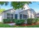 Exterior view of home with screened patio, manicured landscaping and mulch at 3603 Eversholt St, Clermont, FL 34711