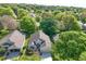 Aerial view of a single-Gathering home with a well-maintained lawn and mature trees at 3603 Eversholt St, Clermont, FL 34711