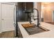 Modern kitchen featuring stainless steel appliances, undermount sink, and wooden butcher block at 3603 Eversholt St, Clermont, FL 34711