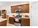 Well-equipped kitchen featuring stainless steel appliances and ample cabinet space at 3666 Arlington Ridge Blvd, Leesburg, FL 34748