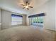 Living Room with carpeted floors and access to lanai at 3827 Westerham Dr, Clermont, FL 34711