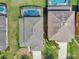 Overhead shot of the roof and a beautiful screened-in pool in the backyard at 4703 Golden Beach Ct, Kissimmee, FL 34746