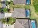 A detailed aerial view shows the house with screened pool and neighborhood at 4703 Golden Beach Ct, Kissimmee, FL 34746