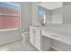 Bathroom featuring white vanity with a quartz countertop at 4703 Golden Beach Ct, Kissimmee, FL 34746