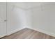 A simple closet space featuring laminate flooring, white walls, and wire shelving at 4703 Golden Beach Ct, Kissimmee, FL 34746