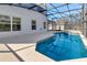 A screened pool area offers a refreshing and private oasis for residents at 4703 Golden Beach Ct, Kissimmee, FL 34746