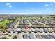Aerial view of a residential community with well-maintained homes and surrounding green spaces at 5829 Tupelo Ter, The Villages, FL 32163