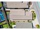 Aerial view of the property showcasing the layout, screened-in pool, landscaping, and surrounding neighborhood at 5829 Tupelo Ter, The Villages, FL 32163