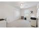 Bright bedroom with a ceiling fan, closet, window, and a workspace with desk and printer at 5829 Tupelo Ter, The Villages, FL 32163