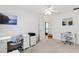 Bright bedroom featuring two workspaces with neutral walls, a ceiling fan, and calming decor at 5829 Tupelo Ter, The Villages, FL 32163
