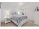 Bright and cozy bedroom with a queen-sized bed, side tables, and a window with natural light at 5829 Tupelo Ter, The Villages, FL 32163