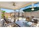 Outdoor screened patio area offers shade, ample seating, and pleasant views of the backyard at 5829 Tupelo Ter, The Villages, FL 32163