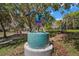 A modern art installation stands in a lush green park at 590 Sandlake Ct, Mount Dora, FL 32757