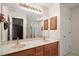 Bathroom featuring double sinks and a large mirror at 604 Juanita Ct, The Villages, FL 32159