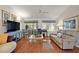 Comfortable living room with hardwood floors and a cozy seating area at 604 Juanita Ct, The Villages, FL 32159