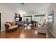Comfortable living room featuring hardwood floors with a cozy sofa and furniture at 604 Juanita Ct, The Villages, FL 32159