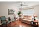 Cozy living room featuring hardwood floors and natural lighting at 604 Juanita Ct, The Villages, FL 32159