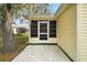 Exterior view of the patio with access to a screened-in lanai at 604 Juanita Ct, The Villages, FL 32159