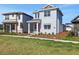 Charming two-story home featuring a red front door and well-manicured lawn at 6553 Rover Way, St Cloud, FL 34771