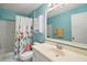 Light blue bathroom featuring vanity, large mirror, toilet, and shower at 7650 Se 174Th Gaillard Pl, The Villages, FL 32162