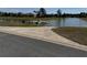 Community boat ramp and dock on a serene lake surrounded by green landscape at 8165 Bridgeport Bay Cir, Mount Dora, FL 32757