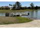 Picturesque community dock on a tranquil lake, perfect for boating and fishing at 8165 Bridgeport Bay Cir, Mount Dora, FL 32757