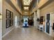 Grand lobby with soaring ceilings, decorative lighting, and elegant furnishings at 8165 Bridgeport Bay Cir, Mount Dora, FL 32757