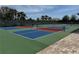 Community pickleball courts with vibrant colors and a well-maintained playing surface at 8165 Bridgeport Bay Cir, Mount Dora, FL 32757