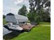 This lakeside property features a private boat dock with a lift and a covered jet ski for waterfront living at 12030 Eagle Point Ct, Leesburg, FL 34788