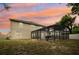 Backyard featuring a screened-in pool enclosure, offering privacy and protection for outdoor enjoyment at 1454 Sterns Dr, Leesburg, FL 34748
