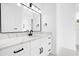 Contemporary bathroom vanity with marble countertop and black hardware at 15749 Acorn Cir, Tavares, FL 32778